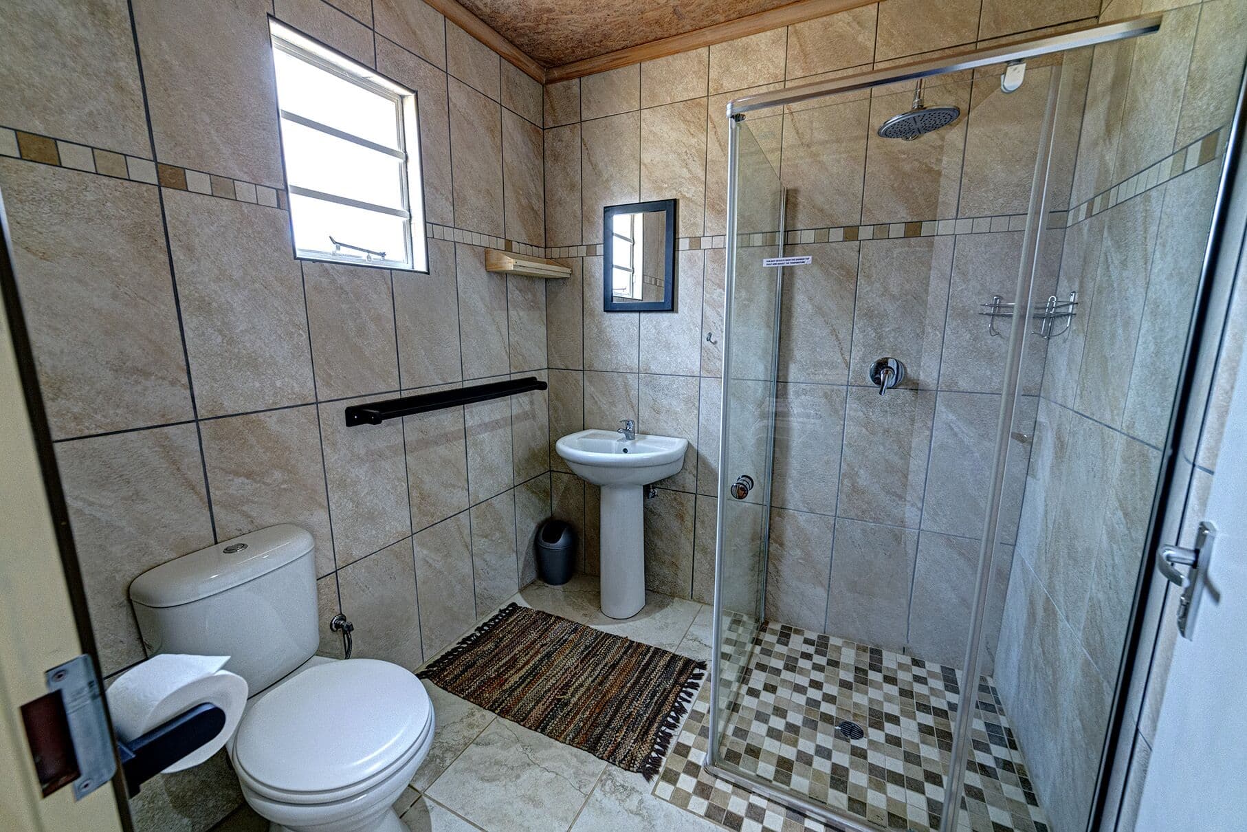 A guest bathroom with shower