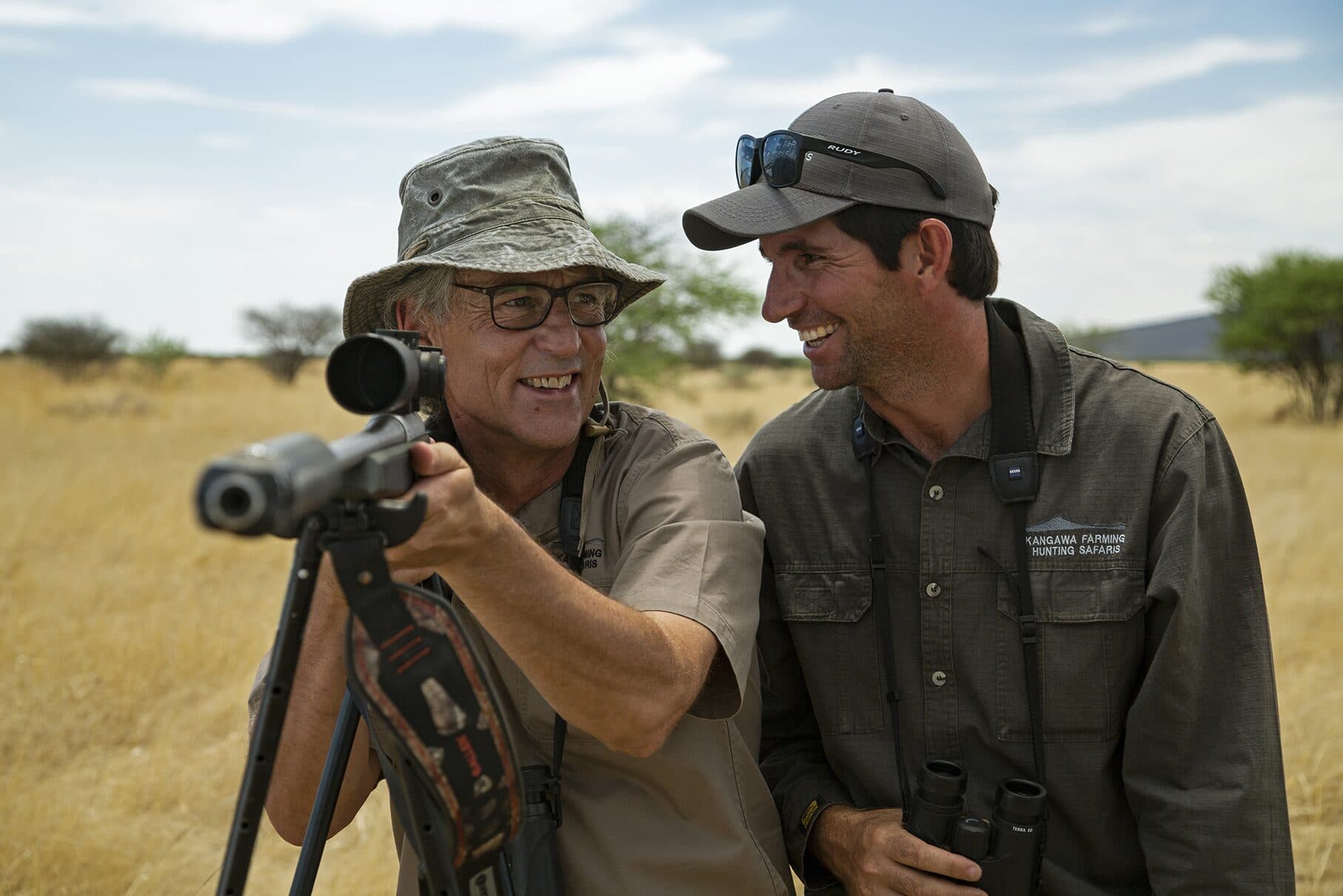 A guest at the shooting sticks, sharing a laugh with Andrew Campbell on a stalk